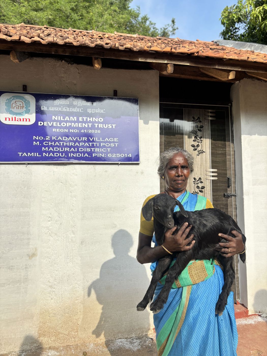 Woman with a goat from the livelihood programme