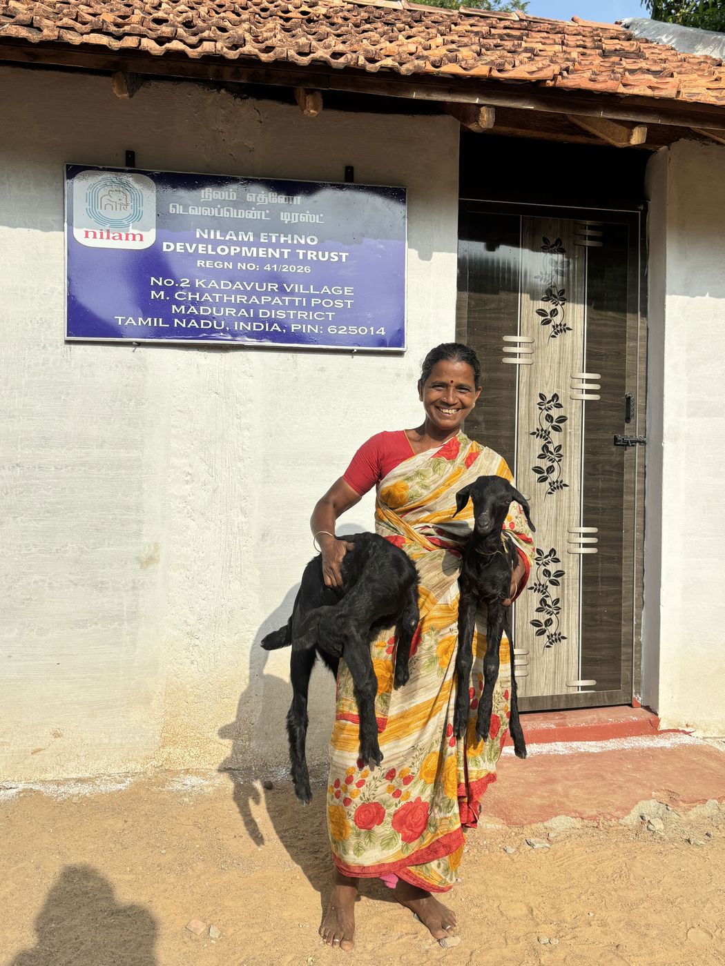 Woman standing with her goat
